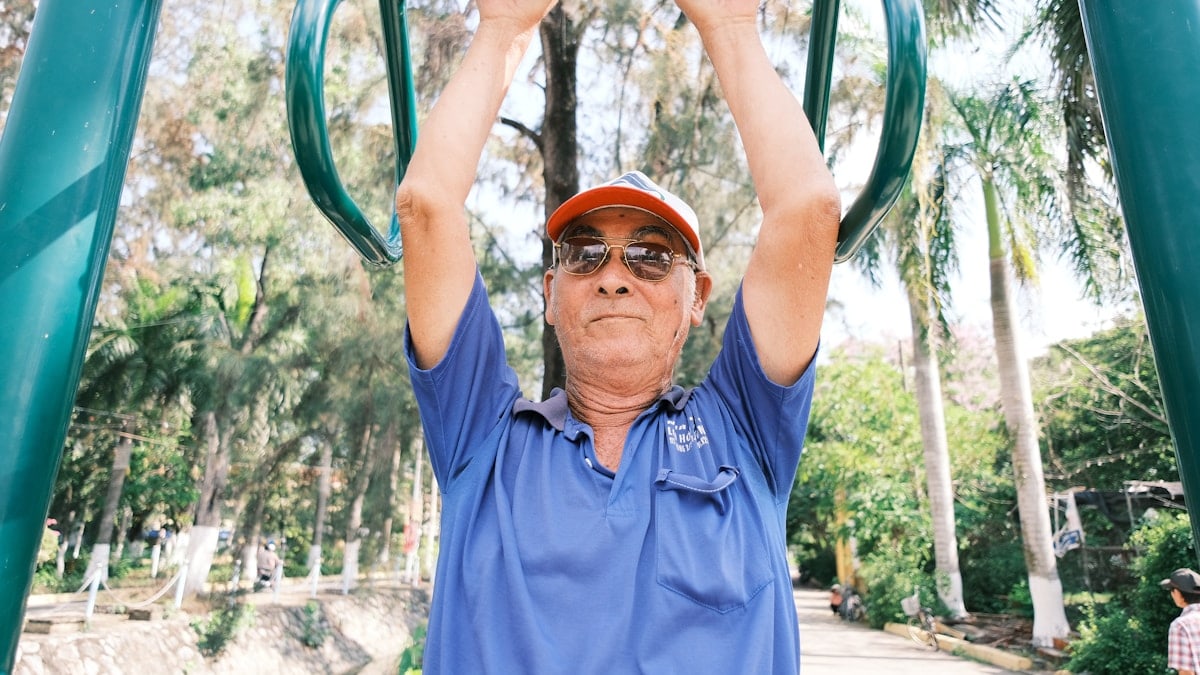 man in blue polo shirt wearing orange goggles